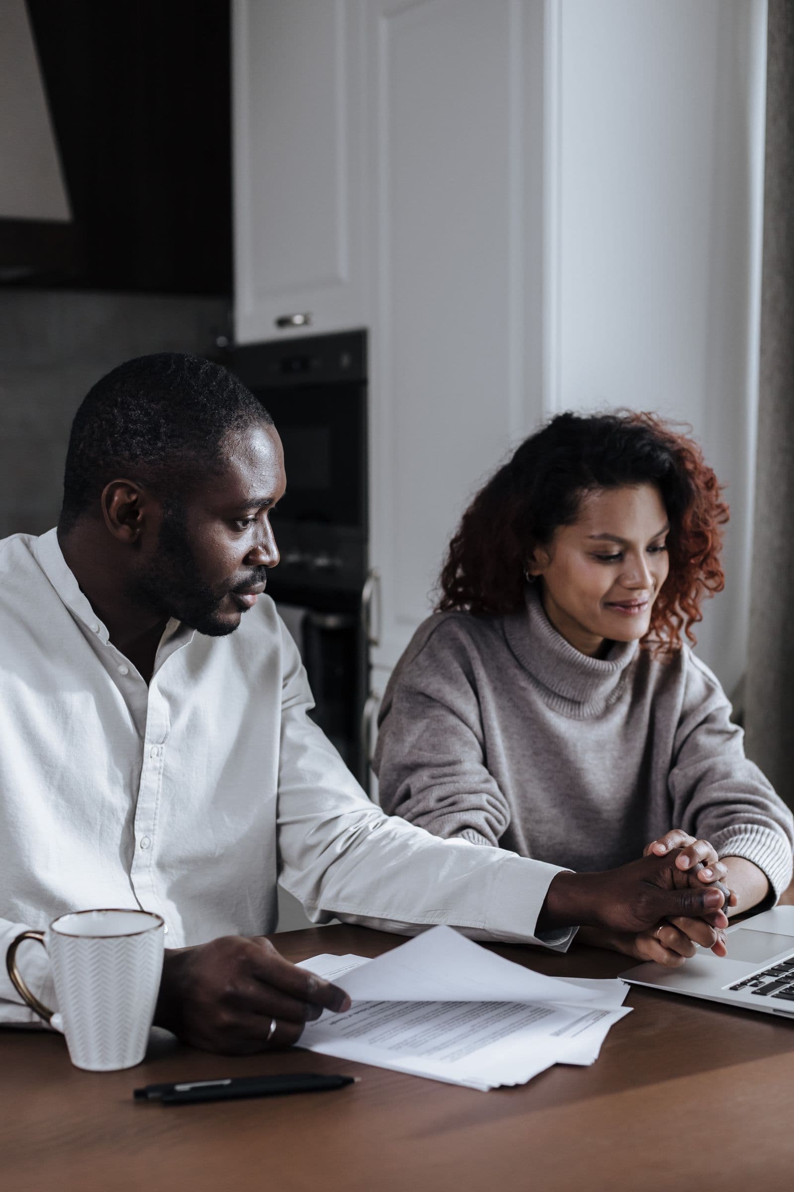 A couple reviewing financial planning documents together